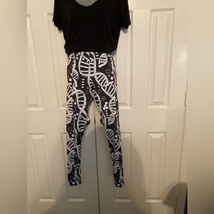Black and white leggings with DNA print. Size large but runs small.